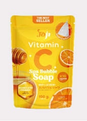 Packaging of Vitamin C Spa Bubble Soap with honey and orange graphics on a yellow background